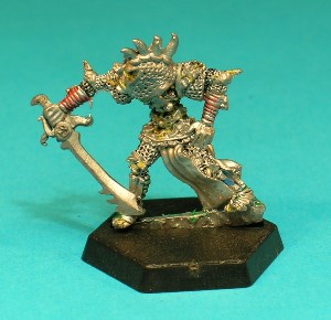 Pose 1, variant C. This Githyanki wears an ornate helmet with wide cheekguards and a pitted pattern on the surface. A row of 4 sharp horns line the top of the helmet, and he look downwards and to his right with his mouth slightly closed.