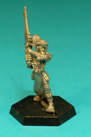 Pose 3, variant B. This Githyanki variant wears a headband with a disc-shaped pattern, and sports the typical Githyanki hairstyle; swept back and upwards into a forwards-pointing peak. He is looking forwards with his mouth hidden in the crook of his arm.