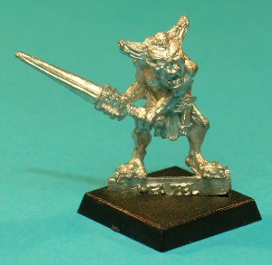 Meazel with Sword, variant C. This variant has a wide-open mouth, and his hair peaks are fairly long and upwards curving. His head looks slightly to the left.
